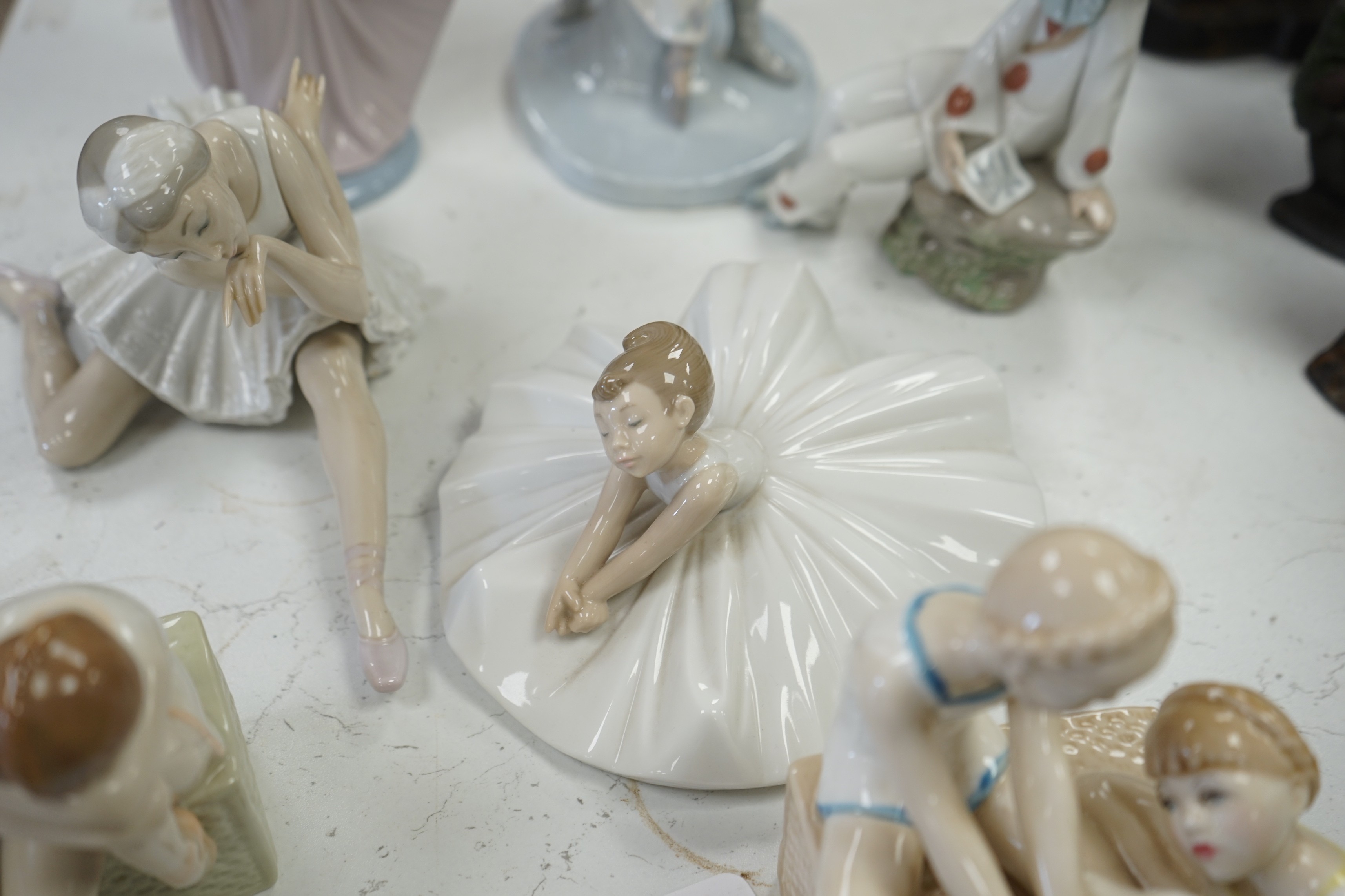 Seven various ceramic figures including Lladro, Nao and Doulton, tallest 33cm